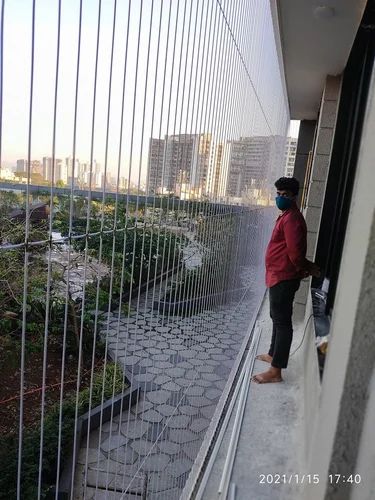 INVISIBLE GRILL FOR HIGH-RISE APARTMENT BALCONY IN PUNE | Chirag Bird Netting Services | INVISIBLE GRILL INSTALLATIIN IN PUNE, SAFETY GRILL IN PUNE, INVISIBLE SAFETY GRILL IN PUNE, INVISIBLE GRILL IN AMANORA, INVISIBLE GRILL IN NANDED CITY, INVISIBLE GRILL IN BLUERIDGE. - GL114382